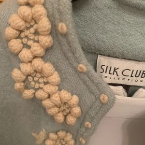 A pure wool long blazer with beige wool appliqués by the Silk Club Collections.